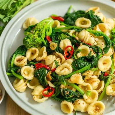  Orecchiette con Cime di Rapa! A symphony of earthy flavors and buttery indulgence awaits your palate.